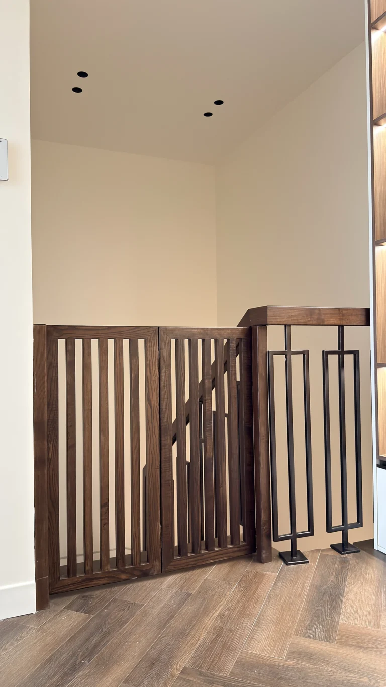 Solid walnut stair gate and balustrade in Dubai, bespoke architectural joinery
